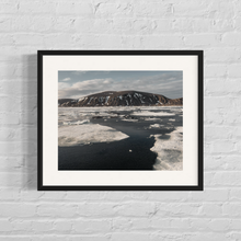 Load image into Gallery viewer, Framed image of sea ice with a frozen barren moutain island in the background in the Svalbard Archipelago