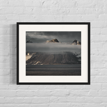 Load image into Gallery viewer, framed image of three mountain peaks lit by the sun at a low angle