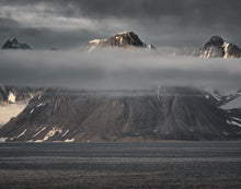 Load image into Gallery viewer, three mountain peaks lit by the sun at a low angle